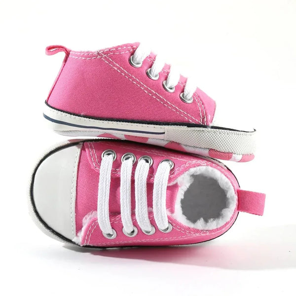 hot pink baby walking shoes with white laces and soft sole for infants