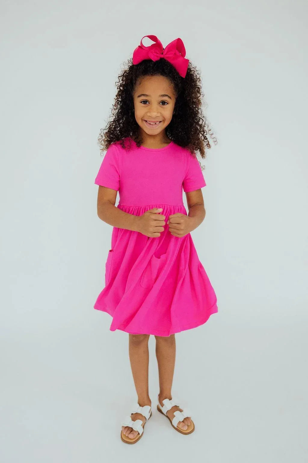 Girls hot pink twirl dress for girls with short sleeves and gathered waist by Mila & Rose