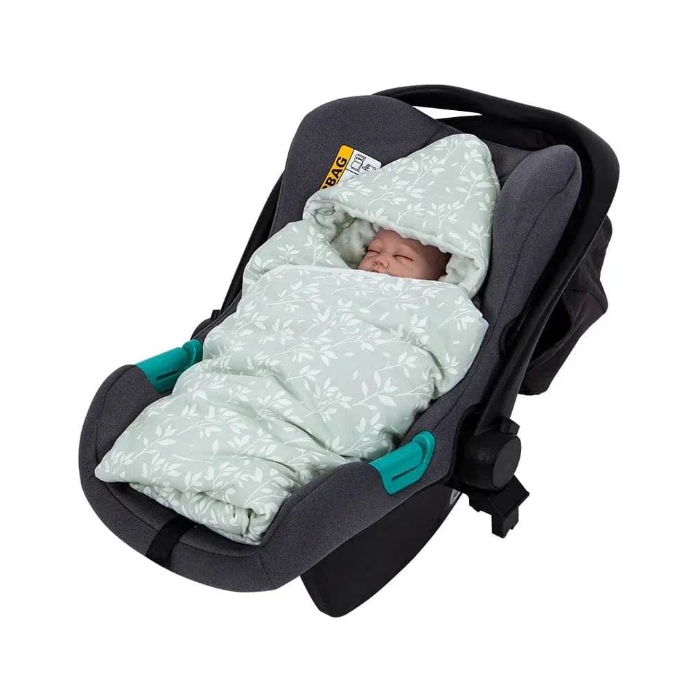Light green ultra soft baby swaddle blanket with white leaf pattern in gray infant car seat