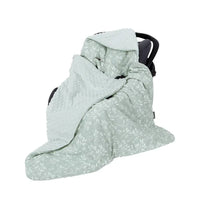 Light green ultra soft baby swaddle blanket made of plush and breathable fabric with leaf pattern