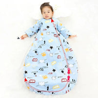 toddler boy lying down wearing light blue zippered sleeping bag for kids with comic print