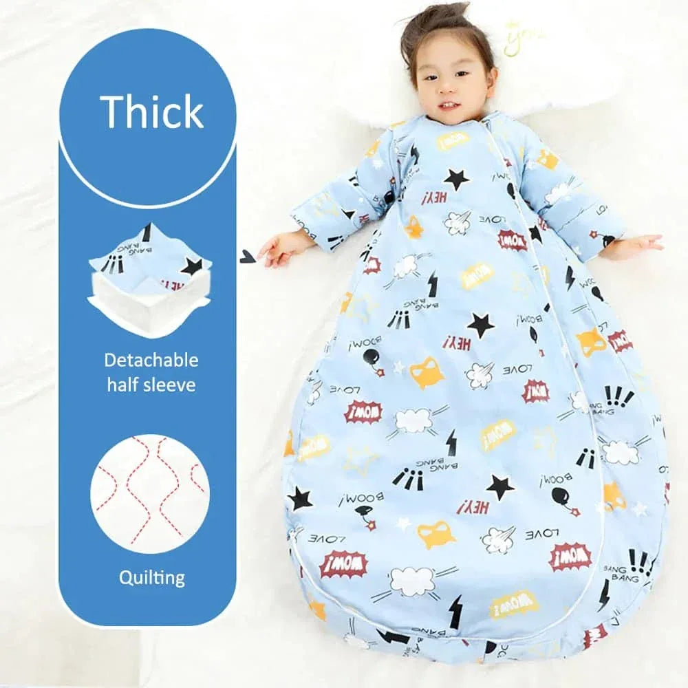 Toddler wearing blue zippered sleeping bag for kids with detachable sleeves and cartoon prints