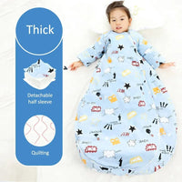 Toddler wearing blue zippered sleeping bag for kids with detachable sleeves and cartoon prints