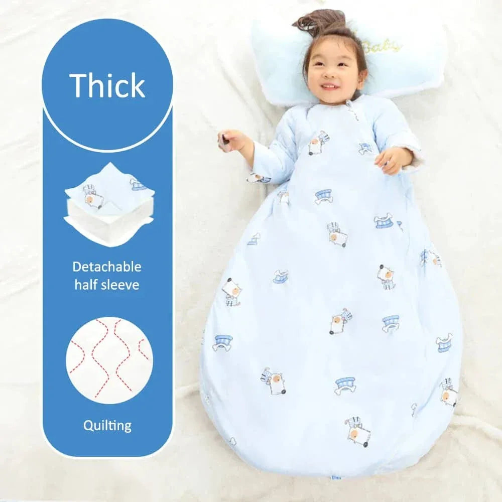 Toddler girl lying down wearing light blue quilted zippered sleeping bag for kids with detachable half sleeves