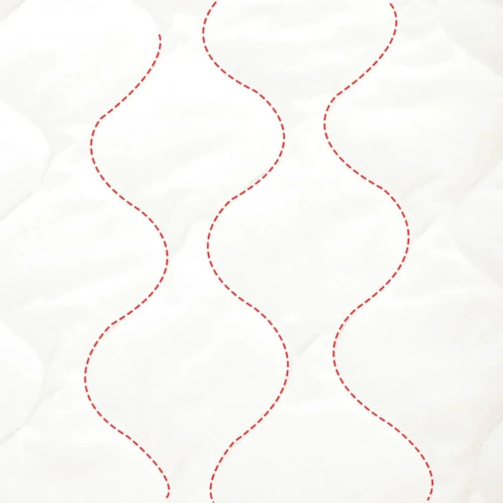 close-up of white quilted fabric with red stitched lines for zippered sleeping bag for kids