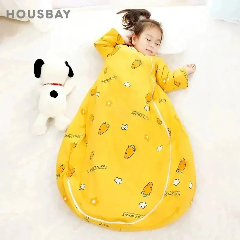 young girl sleeping in yellow zippered sleeping bag for kids with carrot and flower pattern