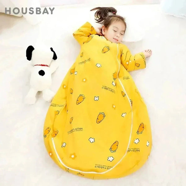 young girl sleeping in yellow zippered sleeping bag for kids with carrot and flower pattern