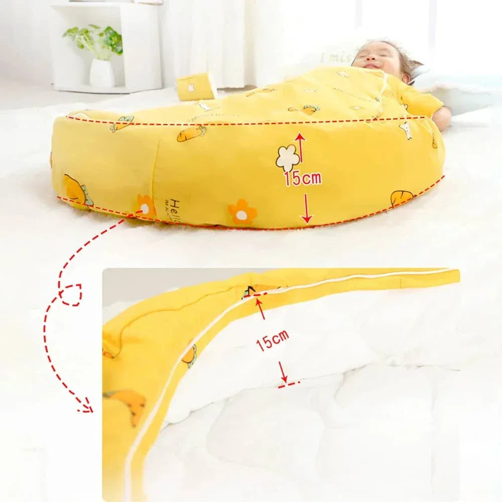 baby lying in yellow zippered sleeping bag for kids with cute animal prints showing 15cm thickness