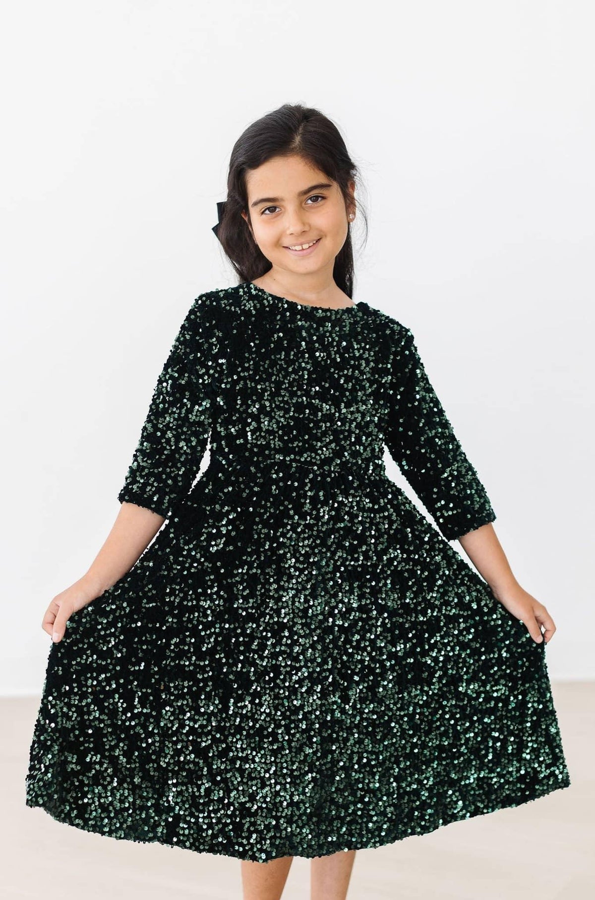 Girls hunter green sequin dress for girls by Mila & Rose with long sleeves and full skirt
