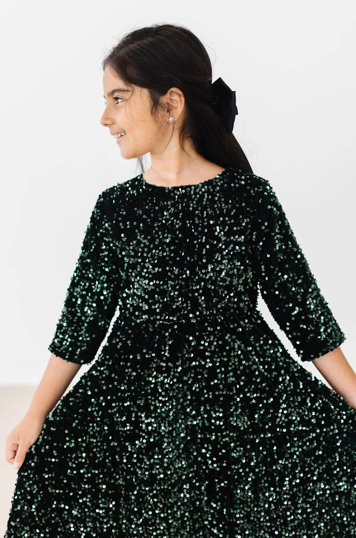 Hunter green sequin dress for girls with three-quarter sleeves and full skirt by Mila & Rose