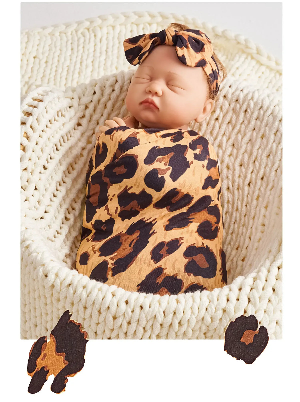 newborn baby swaddled in brown and black leopard print floral baby swaddle blanket set with matching headband