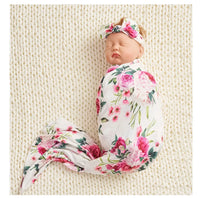 newborn floral baby swaddle blanket set in white with pink flower print and matching headband