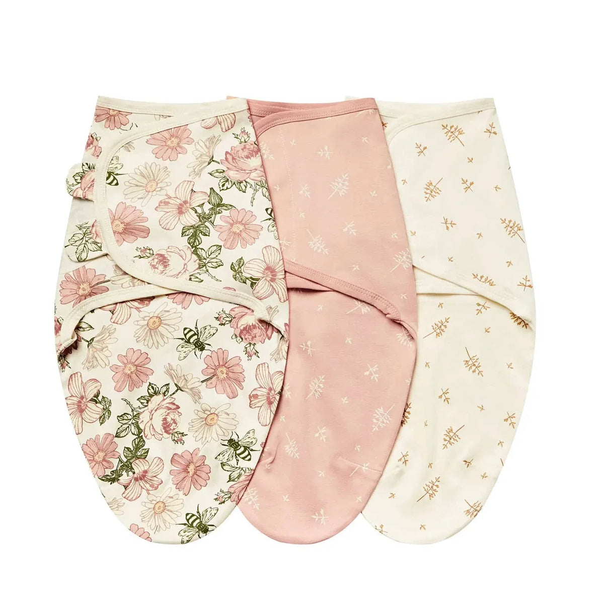 Set of three cotton swaddle bags for babies in pink floral, solid dusty rose, and cream with small yellow prints