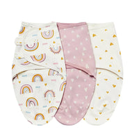 Set of three cotton swaddle bags for babies in white with rainbow, pink with white hearts, and white with yellow hearts