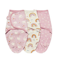 Set of pink and white cotton swaddle bags for babies with swan, rainbow, and heart patterns