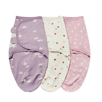 Purple, white, and pink cotton swaddle bags for babies with bird, floral, and heart patterns