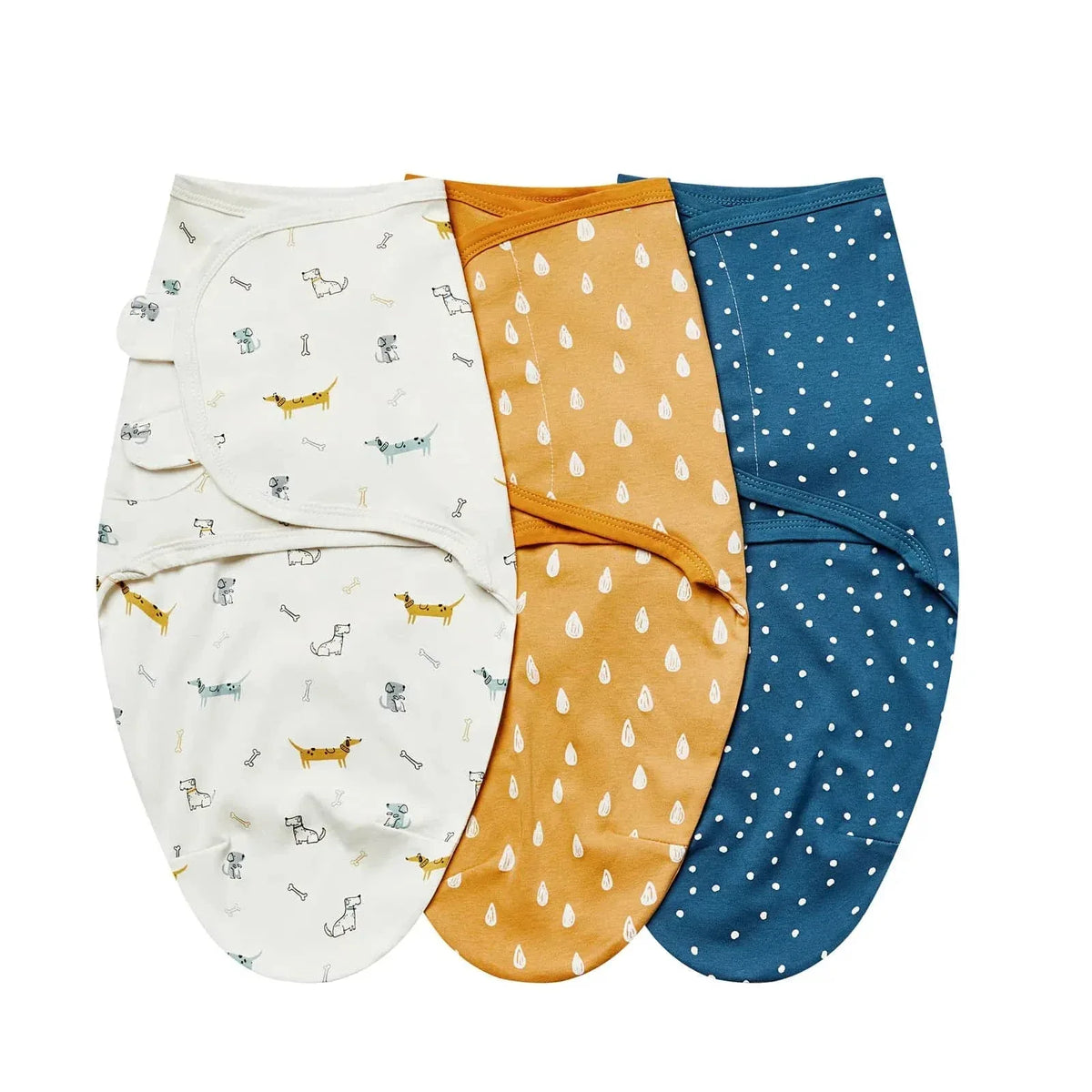 White, mustard yellow, and blue cotton swaddle bags for babies with playful dog, raindrop, and polka dot patterns