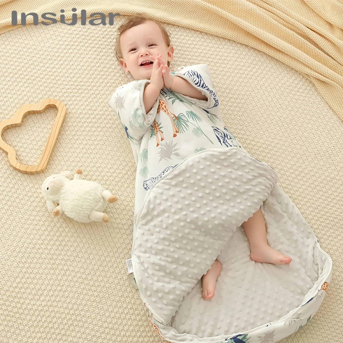 Cream and gray toddler sleep sack with zipper made of soft plush and cotton featuring animal print