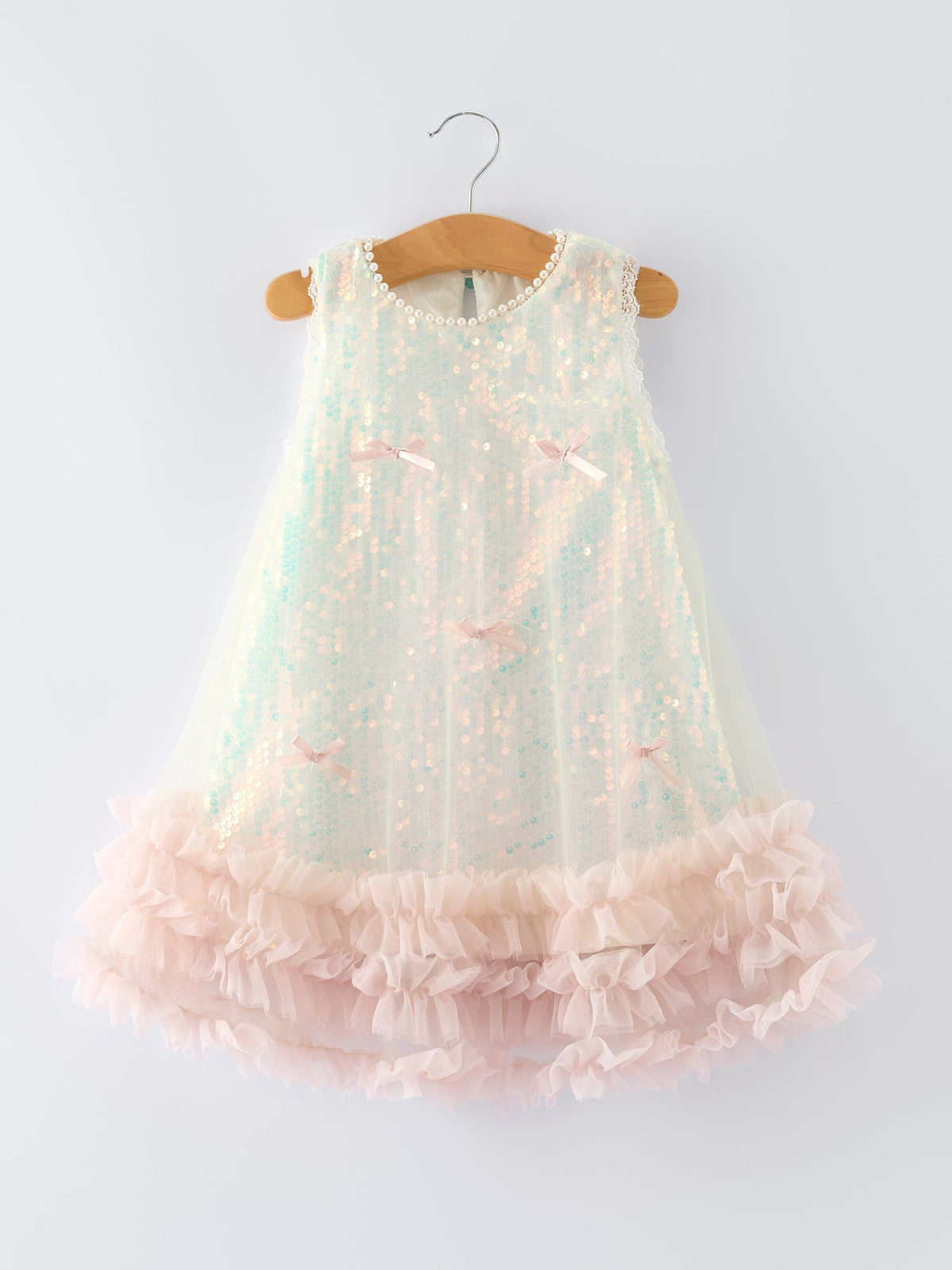 Rylee Faith Designs iridescent sequin girls dress with pink ruffle hem and bow accents, sleeveless toddler size