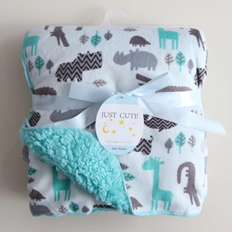 cozy fleece baby blanket in white with teal and gray animal prints, suitable for infants and toddlers