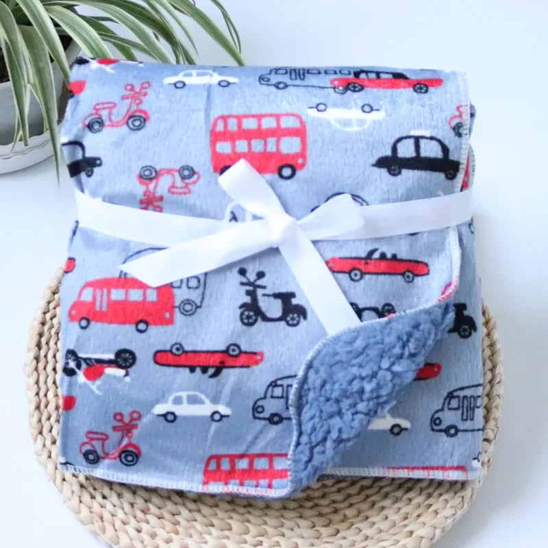 blue cozy fleece baby blanket with red and black vehicle pattern, soft for infants and toddlers