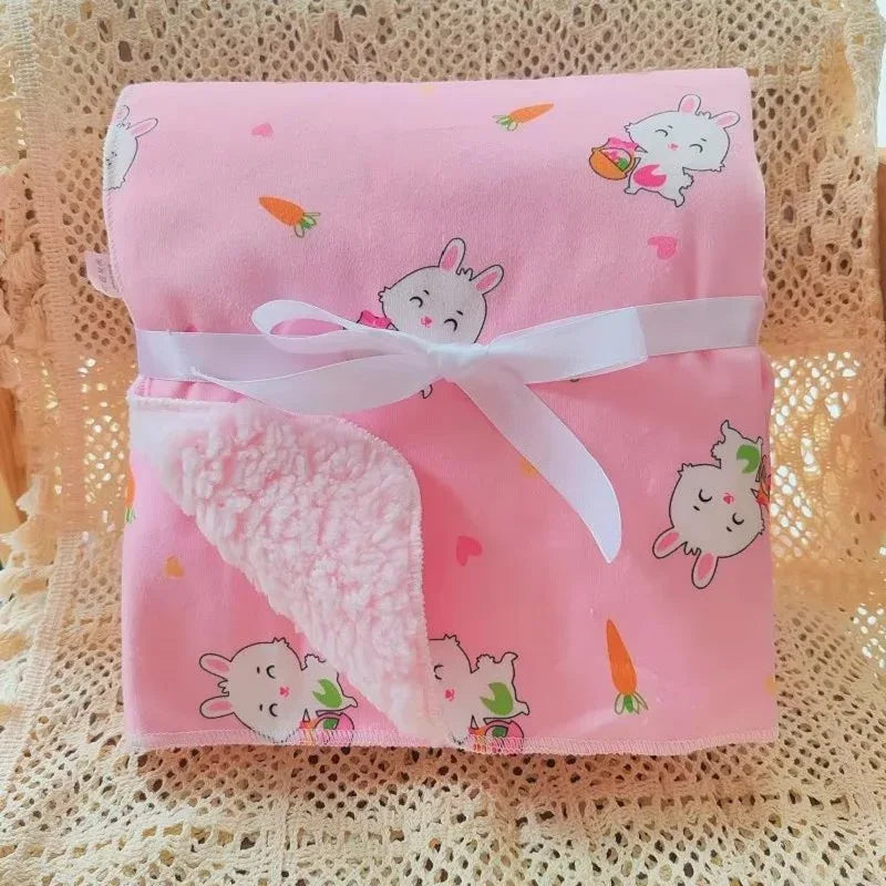 Pink cozy fleece baby blanket for infants with cute bunny and carrot print, soft sherpa lining