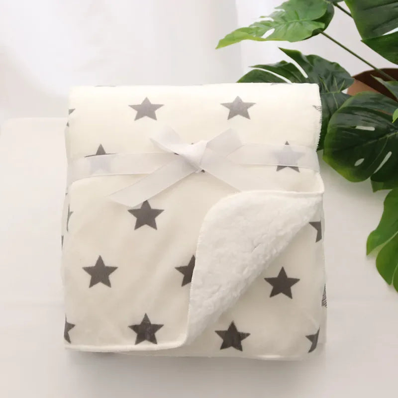White cozy fleece baby blanket with gray stars, soft and warm for infants and toddlers
