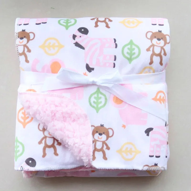 Cozy fleece baby blanket with pink animal print and soft textured backing for infants
