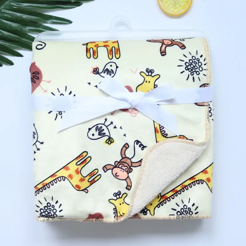 Yellow cozy fleece baby blanket for infants with giraffe and monkey animal prints