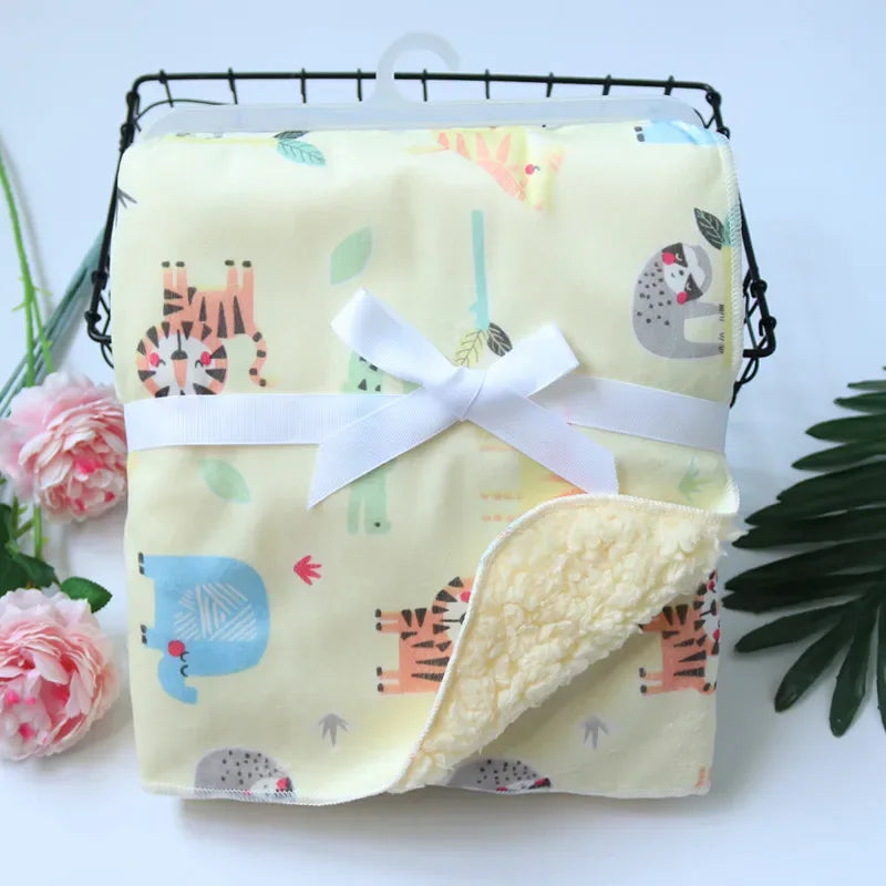 Yellow cozy fleece baby blanket for infants with animal print and white ribbon bow