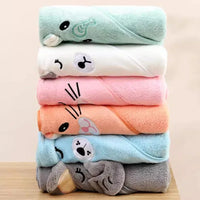 Stack of colorful baby and kids bath towels in green, white, pink, orange, blue, and gray with animal face designs