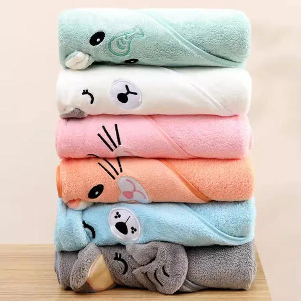 Stack of colorful baby and kids bath towels in green, white, pink, orange, blue, and gray with animal face designs