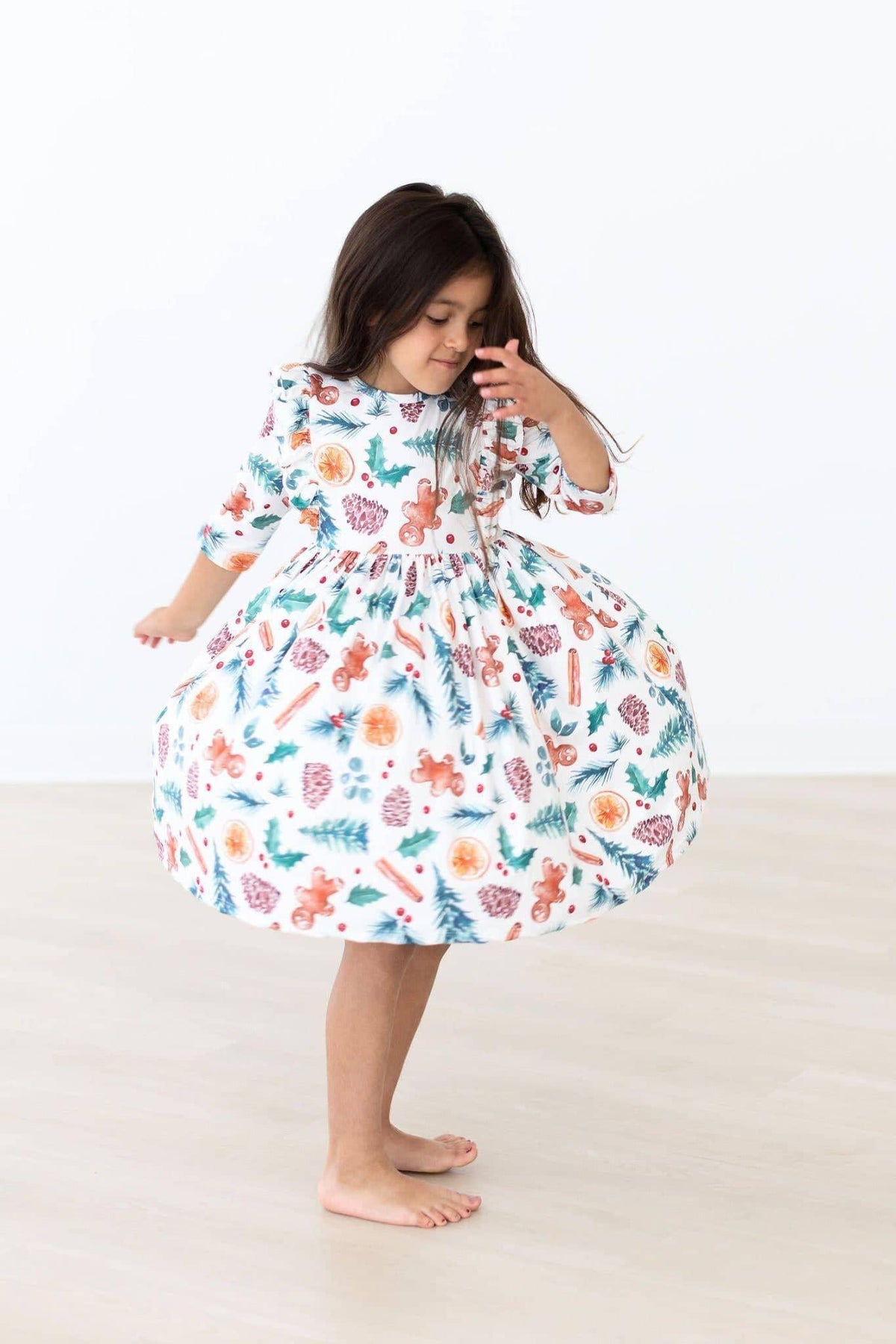 Girls white kids Christmas ruffle dress with colorful holiday print and 3/4 sleeves by Mila Rose