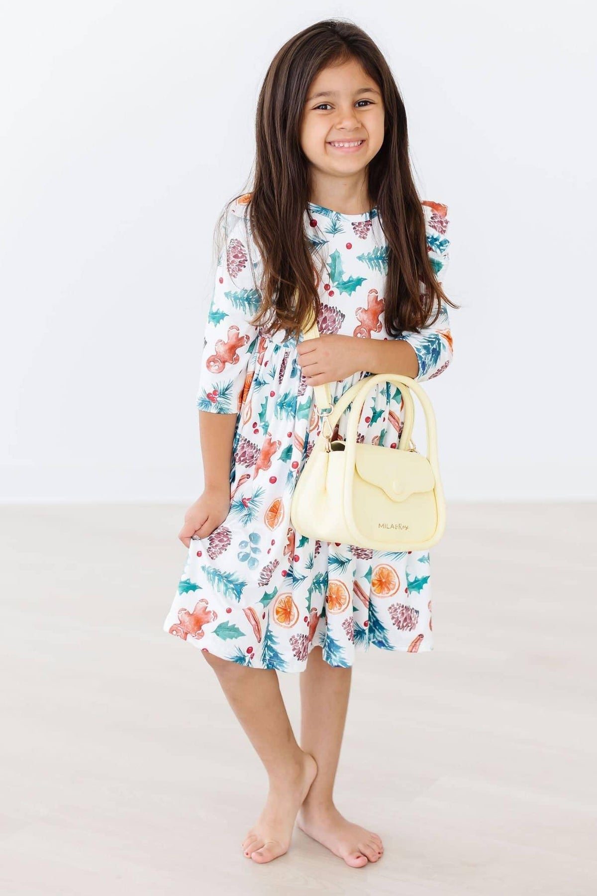 Girls white kids Christmas ruffle dress with colorful festive print and 3/4 sleeves for ages 4 to 6