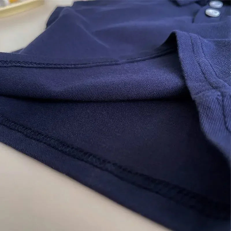 close-up of navy blue fabric detail on kids khaki shorts set for toddlers