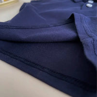 close-up of navy blue fabric detail on kids khaki shorts set for toddlers