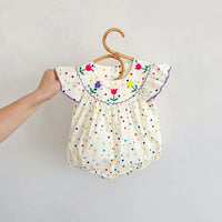 baby white polka dot romper with colorful floral embroidery and ruffled sleeves for infants