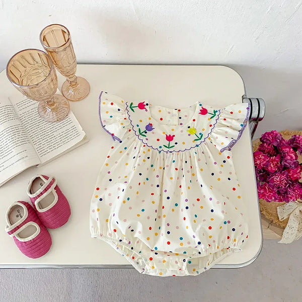 White baby polka dot romper with colorful flower embroidery and flutter sleeves for infants