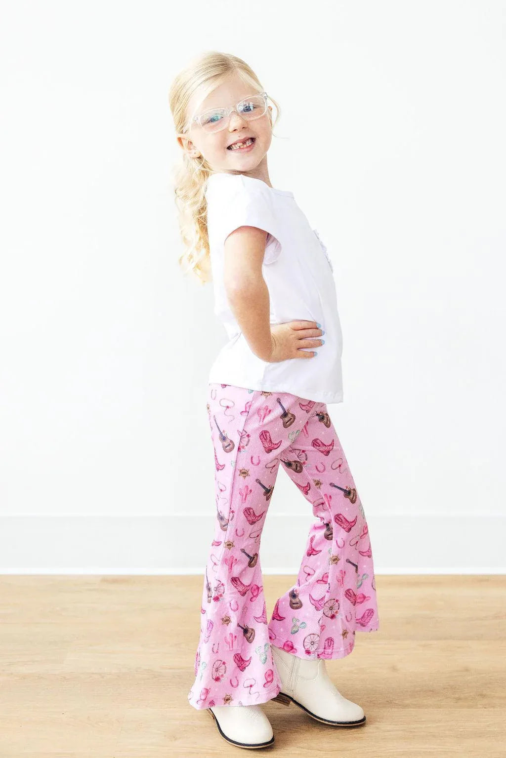 Girls pink kids ribbed velvet bell bottoms with western print in size toddler