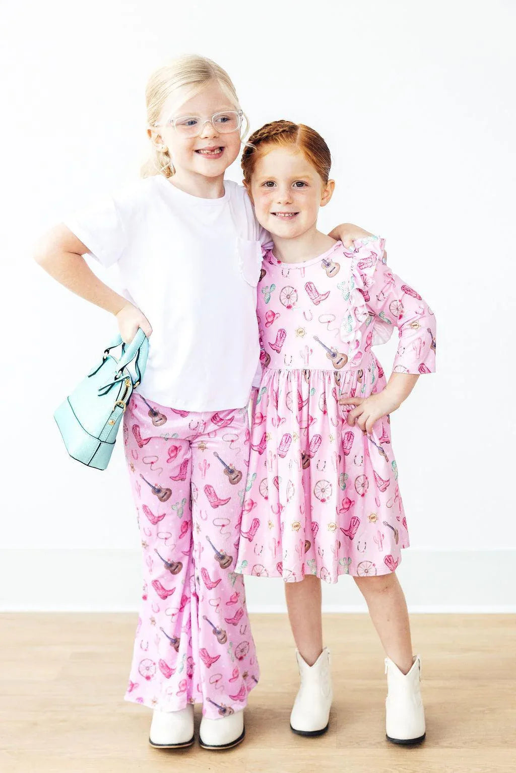 Girls pink kids ribbed velvet bell bottoms with music note print by Mila & Rose, size for children