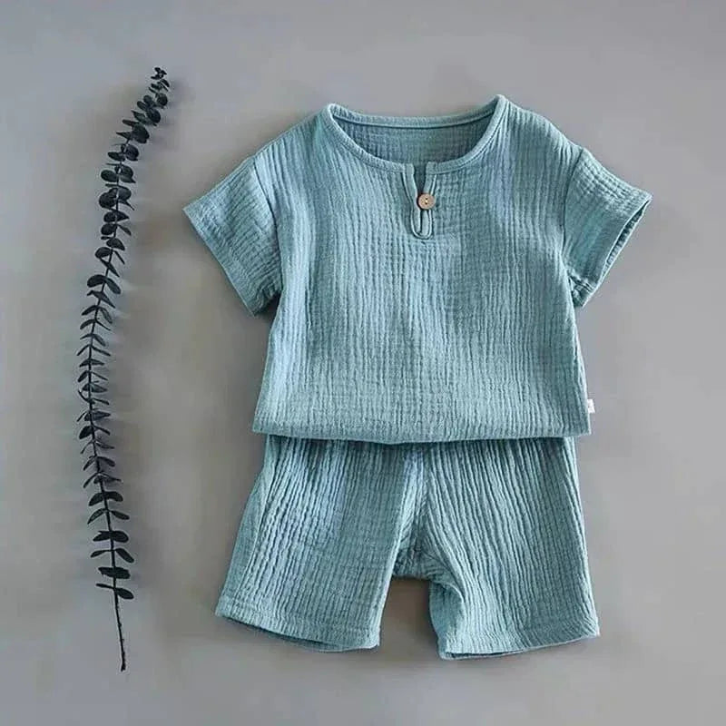 baby blue shorts set for toddlers with textured fabric and button detail on top