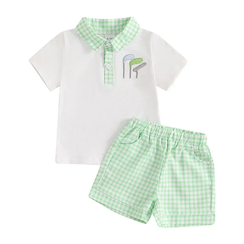 baby boys white polo shirt with green check collar and matching green check shorts set with golf club embroidery