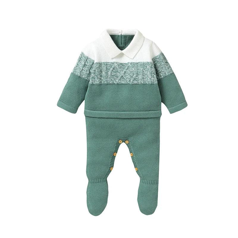 Green and white knit footed romper for infants with cable knit detail and button closures