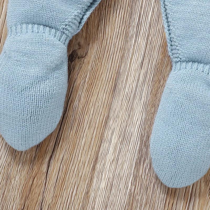 blue knit footed romper for infants in soft fabric with attached feet for newborns