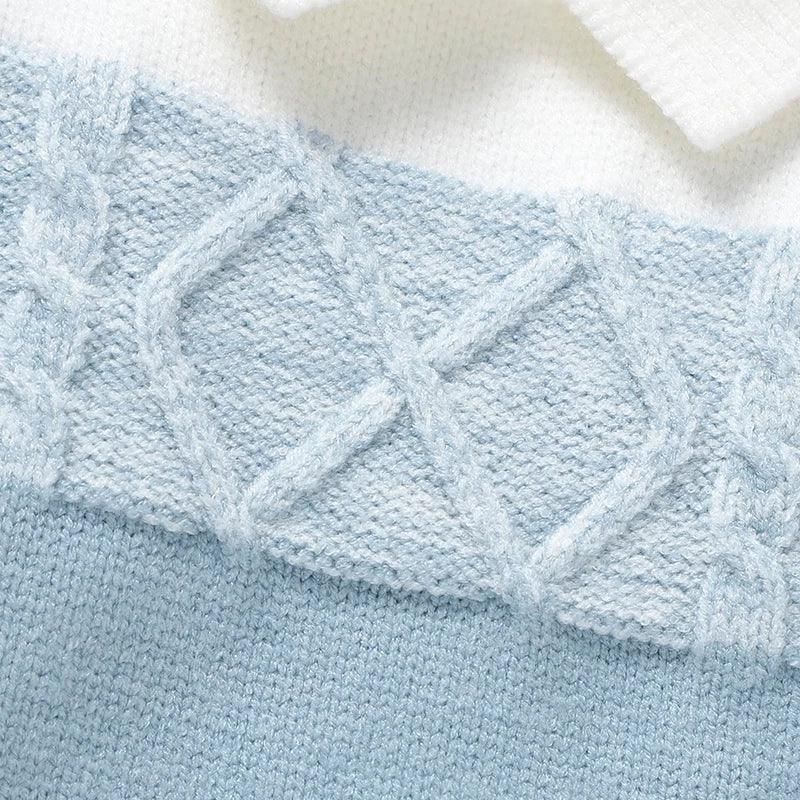 baby blue and white knit footed romper for infants with cable knit detail