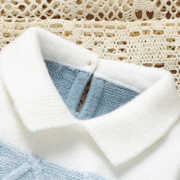 blue and white knit footed romper for infants with a soft collar detail