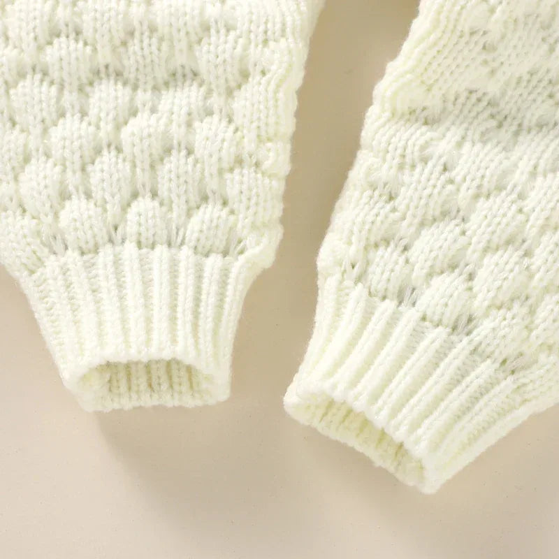 Ivory knit romper set sleeves for babies with textured bubble knit and ribbed cuffs