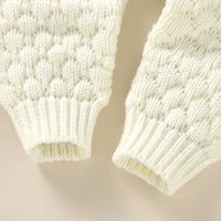 Ivory knit romper set sleeves for babies with textured bubble knit and ribbed cuffs