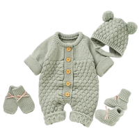 Green knit romper set for babies with wooden buttons, matching hat with bear ears and mittens