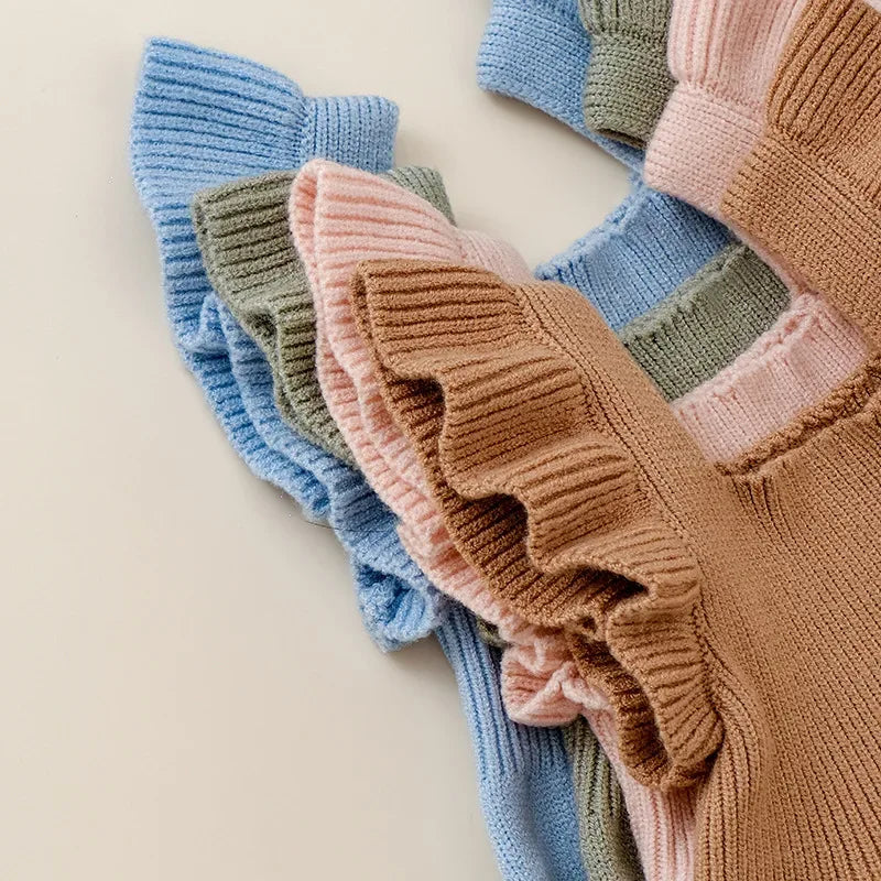 rufflee knit romper for babies in brown pink green and blue colors with soft knit texture